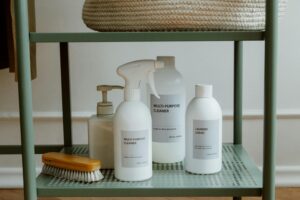 A minimalist display of cleaning products on a shelf, perfect for home organization themes.